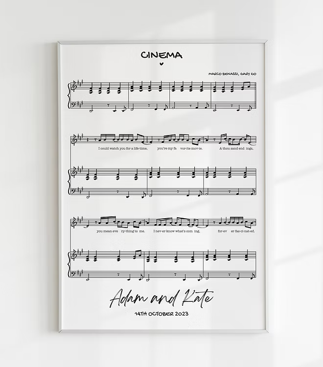 Personalized framed sheet music print featuring a couple’s names and date, customizable love song design, minimalist wall art gift for anniversaries, weddings, and music lovers.