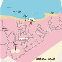 A minimalist personalized map art print of Marsa Alam in pink and blue, featuring a red location pin near The Kite Bar. The custom map includes hand-drawn street details, a river, and 'Since 2021' text at the bottom. Framed against a white wall with soft shadows.