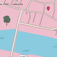 A minimalist personalized map art print of London in pink and blue, featuring a red location pin near The Scalpel and Cannon Street. The custom map includes hand-drawn street details, a river, and 'Since 2022' text at the bottom. Framed against a white wall with soft shadows.