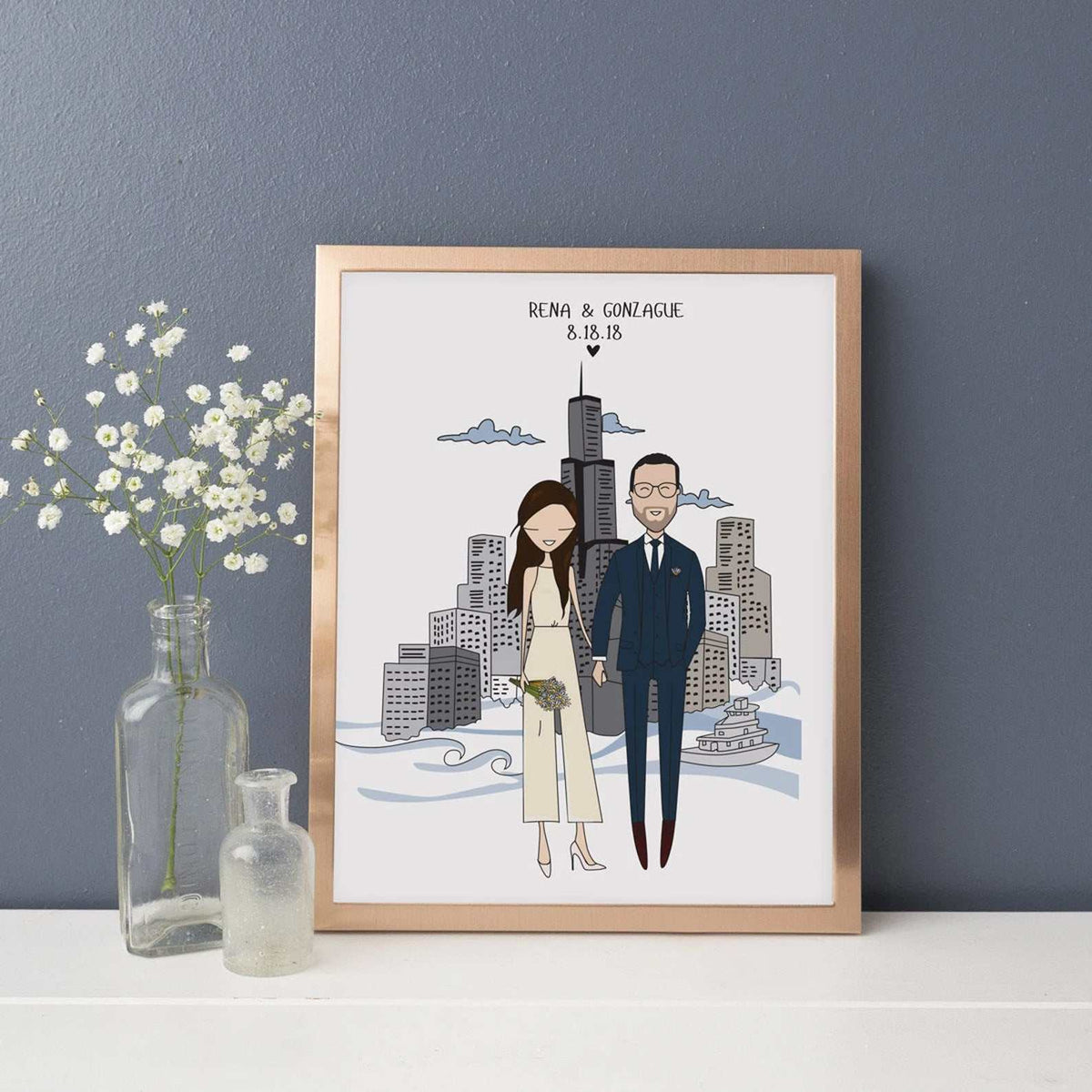 Personalized family portrait with custom background featuring a detailed Chicago city skyline, displayed in a copper frame as a unique wedding anniversary gift. The couple are holding hands and smiling. The text "Rena & Gonzaga 8.18.18" is at the top of the illustration.