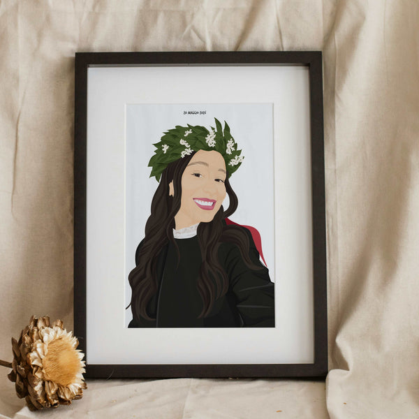 Framed personalized hand-painted portrait illustration of a smiling woman with dark hair wearing a laurel wreath and graduation gown, serving as a unique personalized graduation gift.