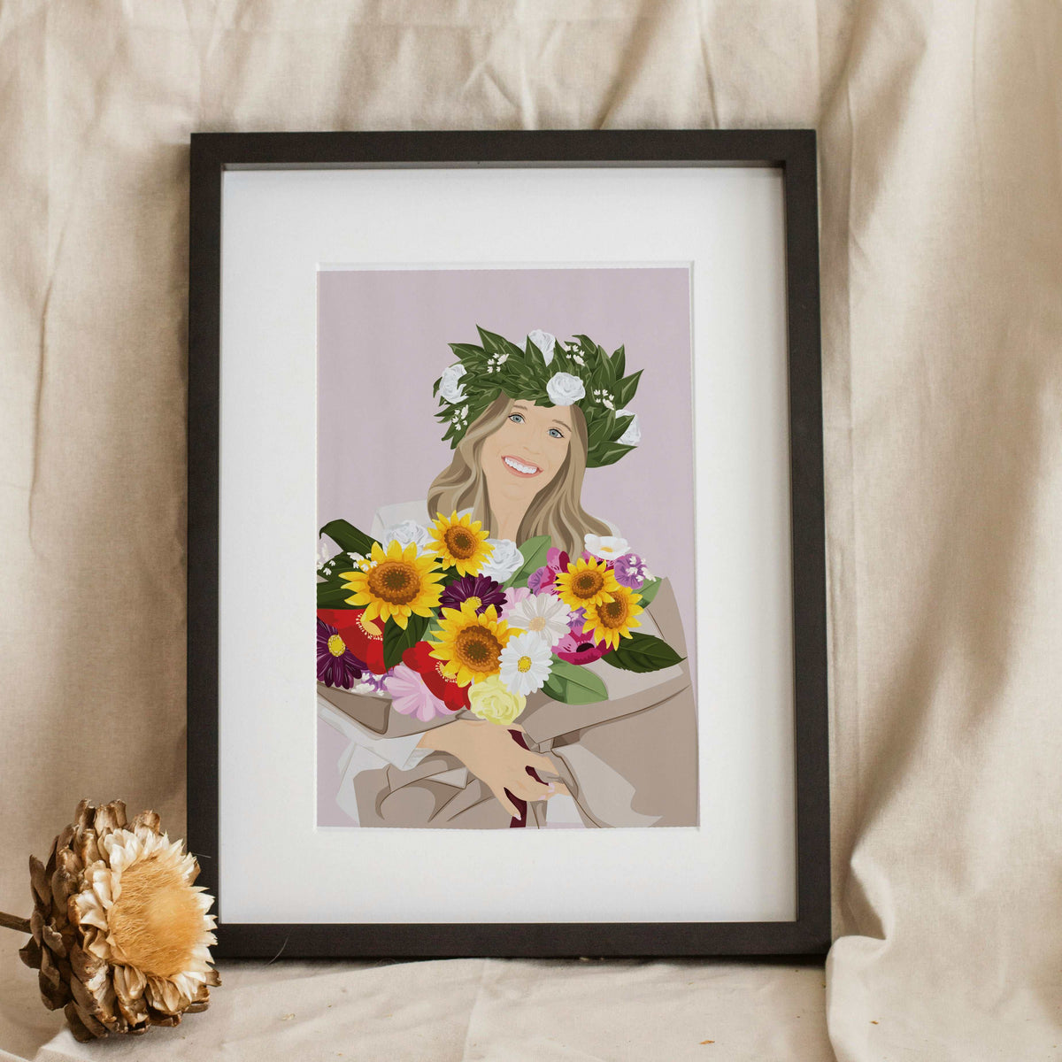 Framed personalized hand-painted portrait illustration of a smiling blonde graduate wearing a laurel crown and holding a huge vibrant sunflower bouquet, a thoughtful graduation gift.