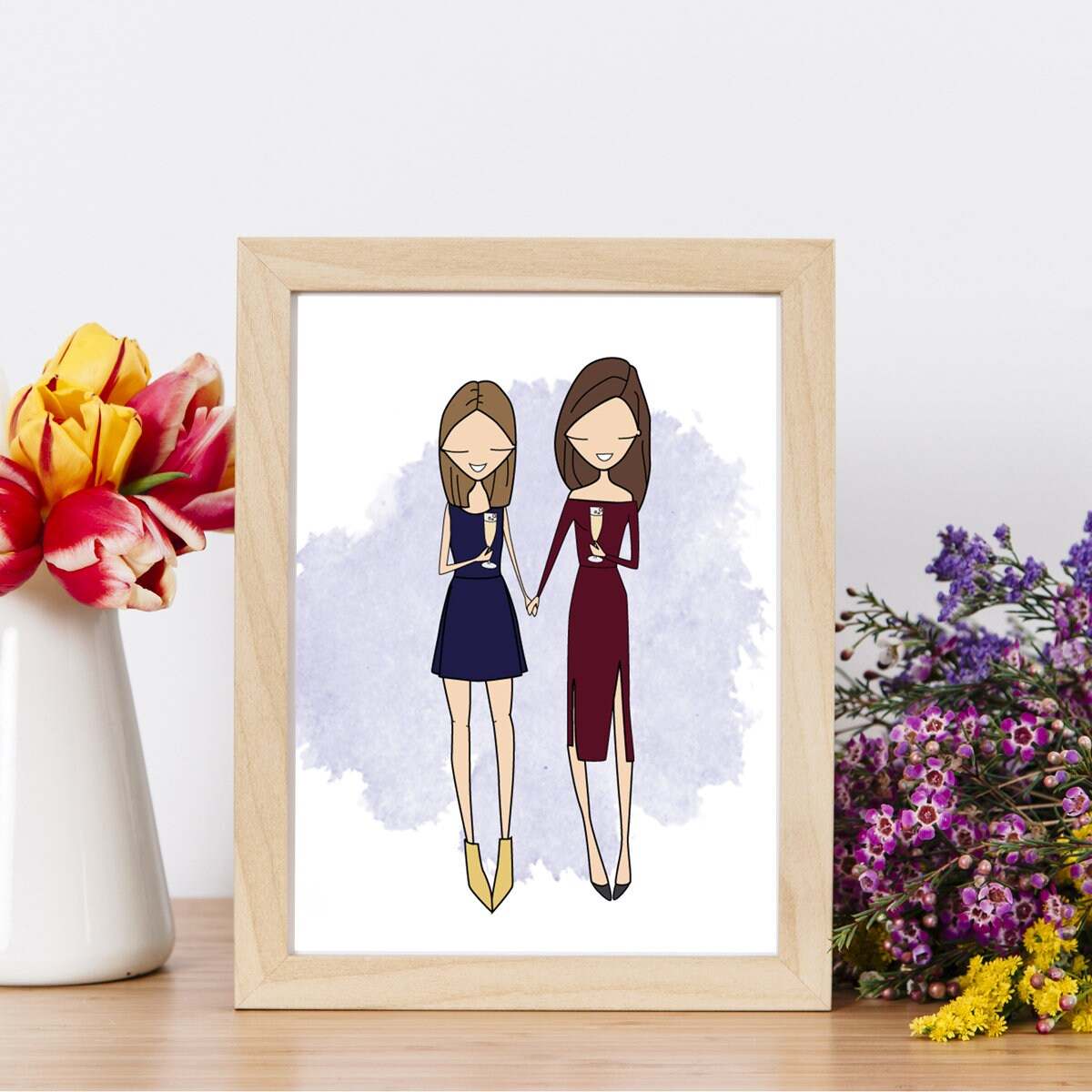 Framed Personalized Friends Portrait depicting two best friends in elegant evening dresses holding champagne glasses over a watercolor background. Elegant choice for a bridesmaid proposal, milestone 30th birthday, or a New Year's Eve celebration memento.