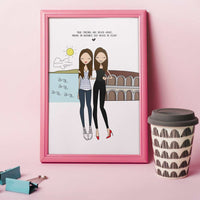 A framed illustration of two women standing together with the text "TRUE FRIENDS ARE NEVER APART, MAYBE IN DISTANCE BUT NEVER IN HEART". One friend is living in Rome, the other one in Trieste. The illustration is set against a background of a blue sky, a yellow sun, a green hill, and a white building with arches.