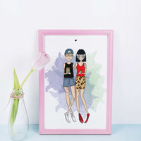 A framed illustration of two people standing side-by-side. The person on the left is wearing a blue baseball cap, a black shirt, blue denim shorts, and white trainers. The person on the right is wearing a red tank top, a leopard print skirt, and red trainers. The background is a watercolour wash of purple, blue, and green. A trendy, custom birthday gift for a quirky best friend or a fun fashion-focused roommate present.