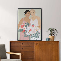 A personalized portrait of a bride and her bridesmaid in elegant gowns, showing the product used as a personalized wedding keepsake or bridesmaid proposal gift.