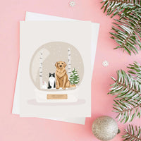 Personalized Pet Portrait for Christmas Card featuring a custom hand-drawn illustration of a Golden Retriever, tuxedo cat, and rabbit inside a festive winter snow globe.