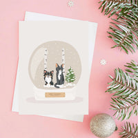 Handmade custom illustration of a long-haired Chihuahua and cat inside a snow globe on a Personalized Pet Portrait for Christmas Card holiday greeting.
