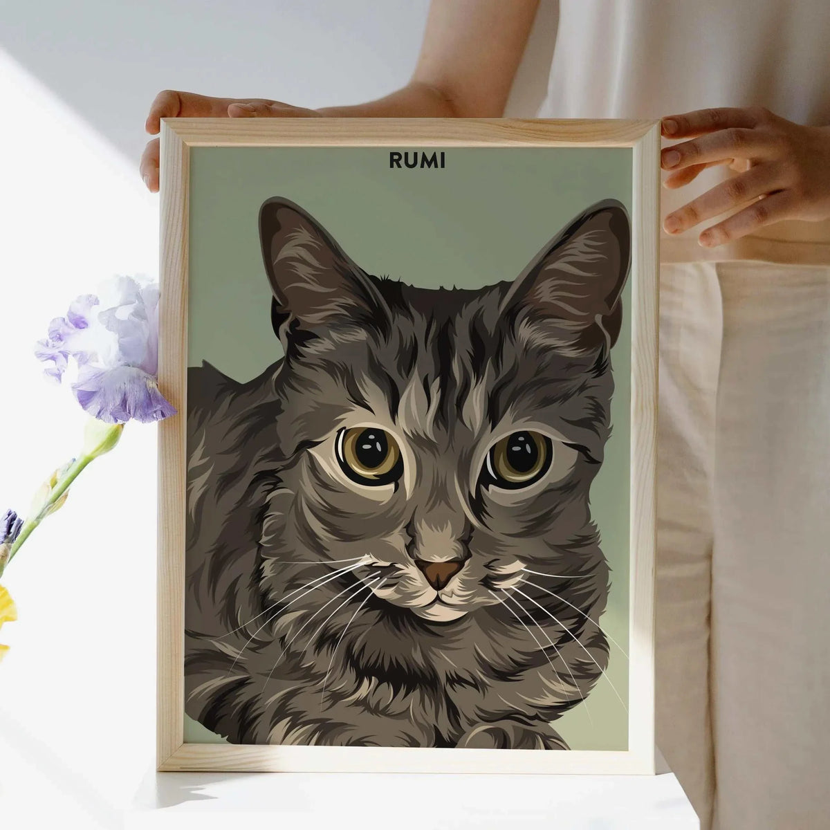 A realistic high quality personalized pet portrait, made from a photo. It shows a tabby cat and above the illustration his name. This unique multi-pet portrait is the perfect cat lover gift, pet memorial art, or personalized wall decor for homes with multiple pets.