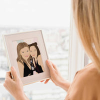A woman holding a Personalized best friend portrait from photo in a light wood frame, featuring a hand-drawn digital illustration of two women laughing, holding a cocktails, with an aesthetic abstract background, perfect for roommate apartment decor.
