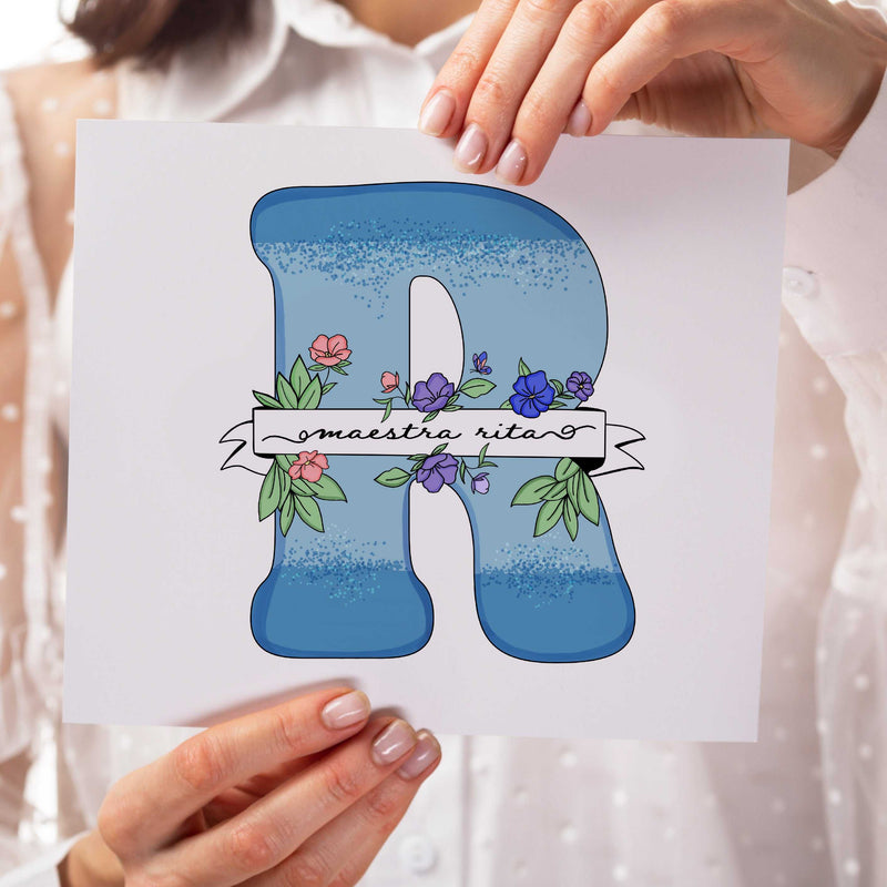 Personalized teacher floral letter illustration, a unique gift for a teacher from students. The hand-drawn initial "R" is light blue with floral accents and a custom name banner. This A5/A4 print is a thoughtful last-minute teacher thank you gift that can be customized with personal quotes for a heartfelt classroom keepsake.